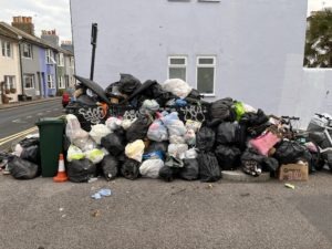 Rubbish piles up in Brighton streets as refuse worker strike continues into seventh day.
