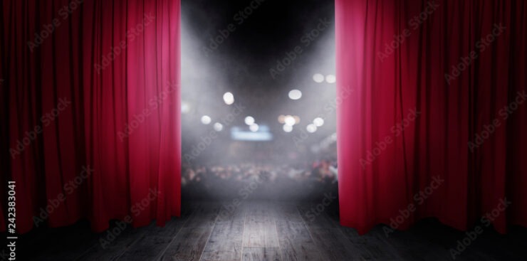 The red curtains are opening for the theater show